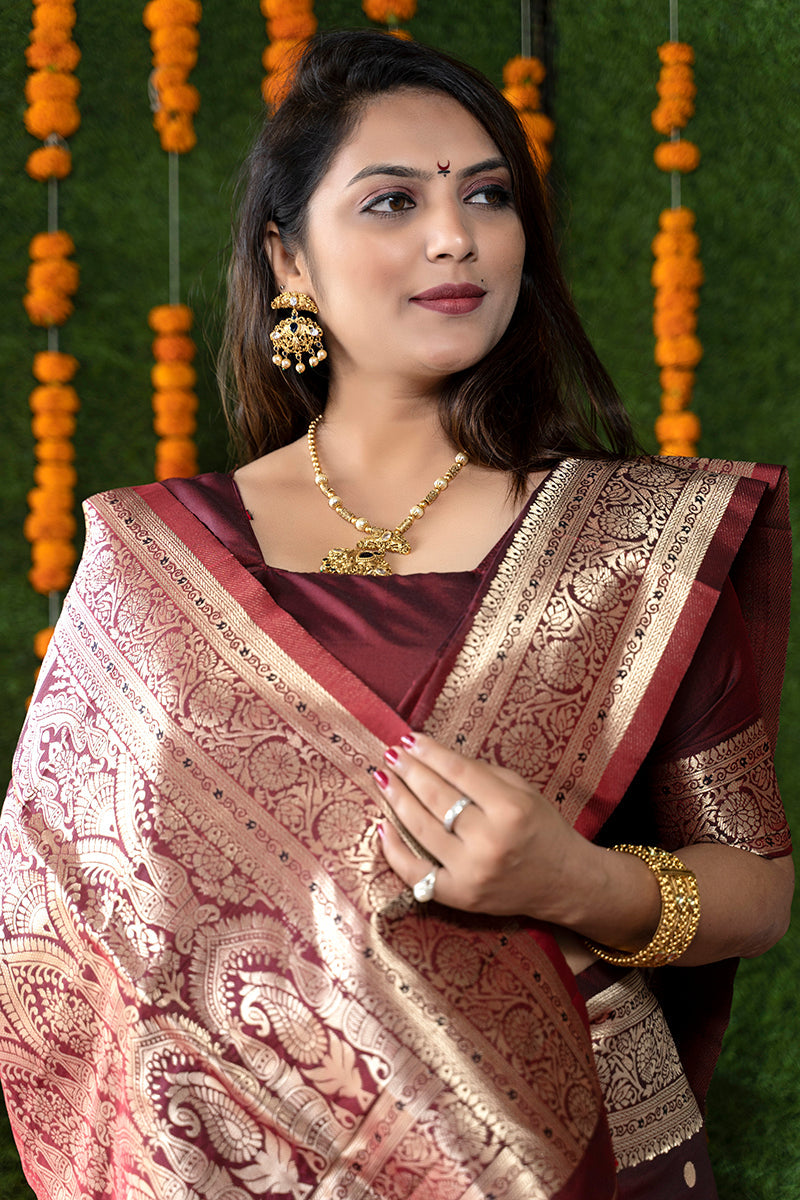 Monjolika Fashion Maroon Woven Banarasi Silk Blend Saree With Blouse