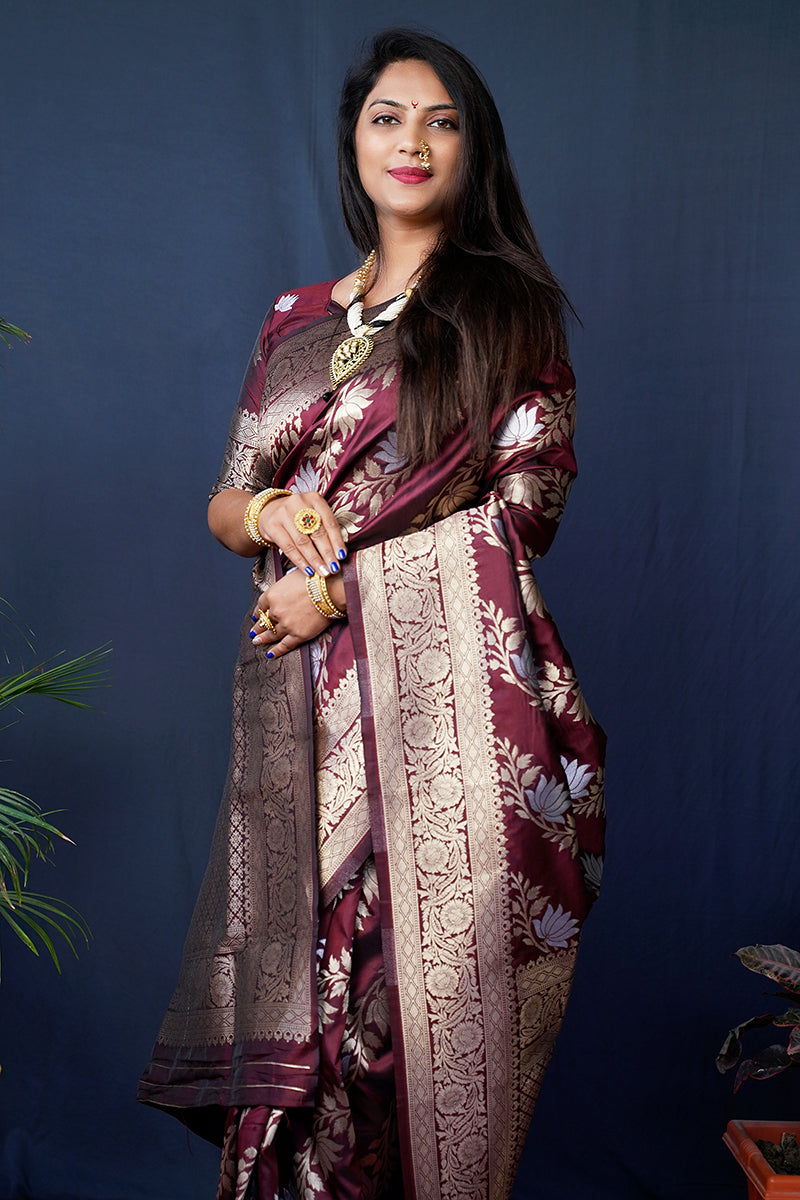 Monjolika Fashion maroon Woven Banarasi Silk Blend Saree With Blouse