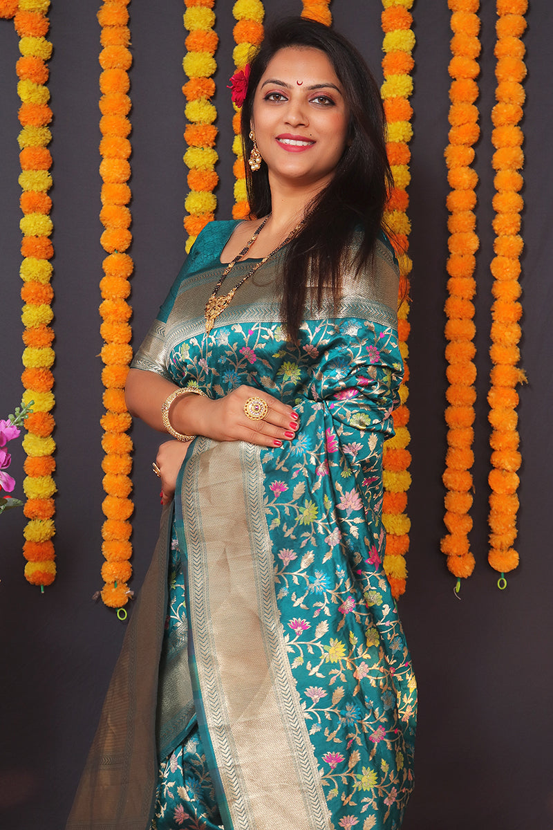 Monjolika Fashion Teal Blue Banarasi Silk Blend Saree With Floral Jaal & Zari Border