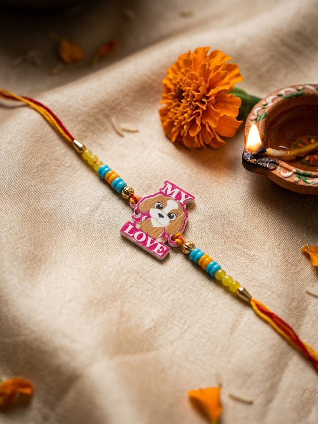 NVR Stylish Artificial Beads Kids Thread Rakhi with Roli Chawal Chandan Mishri
