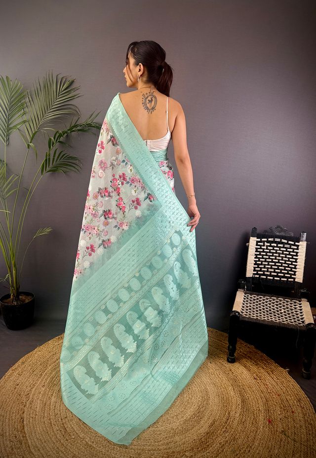 Elora Cyan Blue Silk Floral Motifs Coppery Tone Contrast Floral Border Banarasi Saree