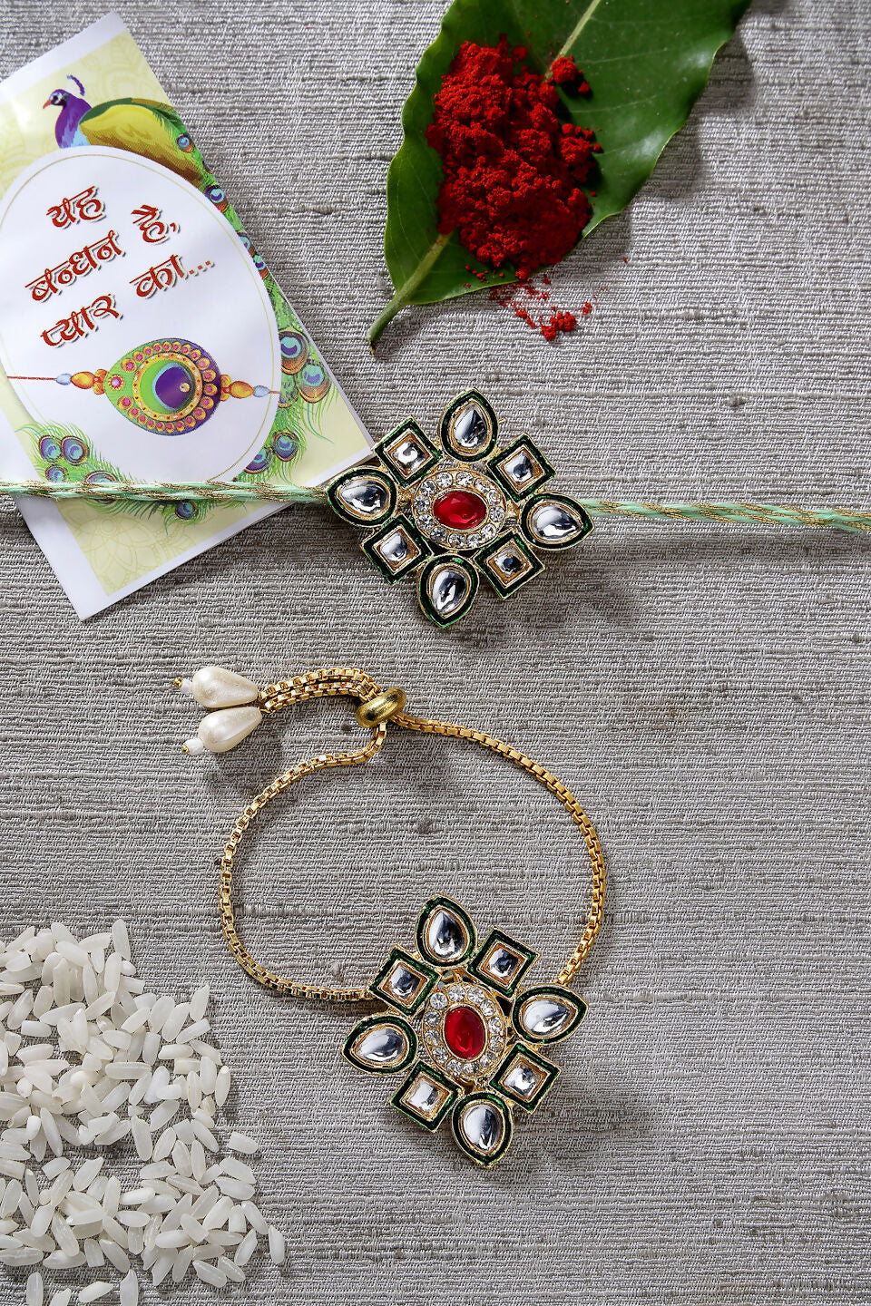 NVR Women & Men Set of 2 Gold Kundan-Studded Handcrafted Wraparound Rakhi Set With Roli Chawal