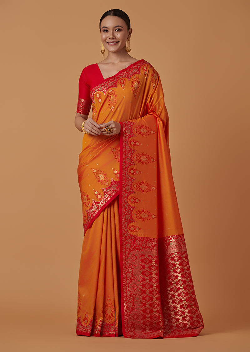 Monjolika Fashion Amber Banarasi Silk Blend SareeWith Zari Woven Rich Brocade Design