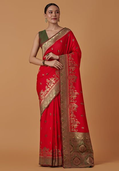Monjolika Fashion Red Banarasi Silk Blend SareeWith Traditional & Modern Dulha Dulhan Figure Zari Woven Detailing