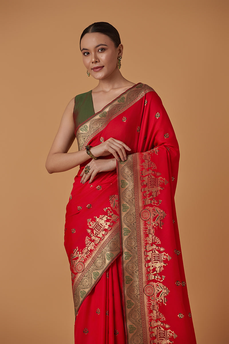 Monjolika Fashion Red Banarasi Silk Blend SareeWith Traditional & Modern Dulha Dulhan Figure Zari Woven Detailing