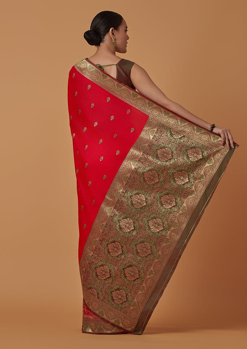 Monjolika Fashion Red Banarasi Silk Blend SareeWith Traditional & Modern Dulha Dulhan Figure Zari Woven Detailing