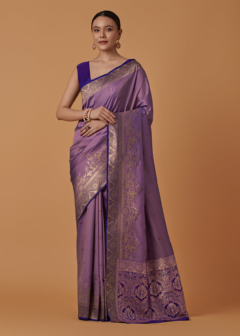 Monjolika Fashion Lavender Banarasi Silk Blend SareeWith Traditional & Modern Dulha Dulhan Figure Zari Woven Detailing
