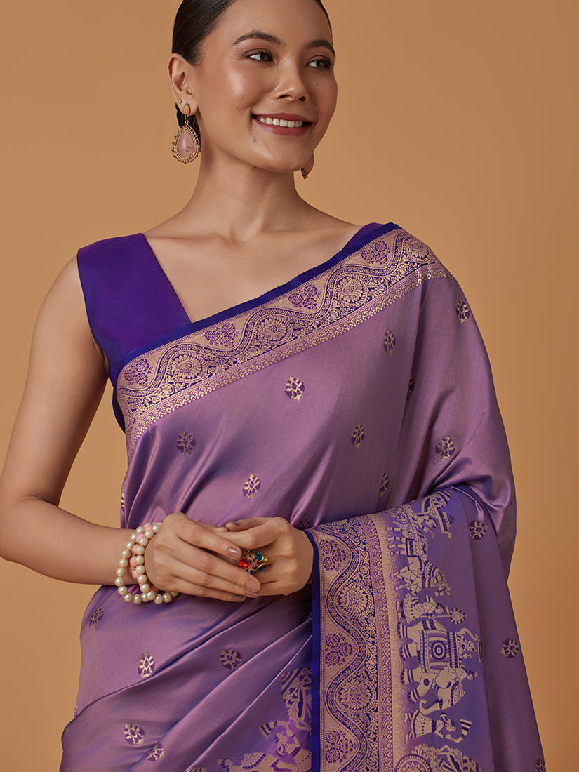 Monjolika Fashion Lavender Banarasi Silk Blend SareeWith Traditional & Modern Dulha Dulhan Figure Zari Woven Detailing
