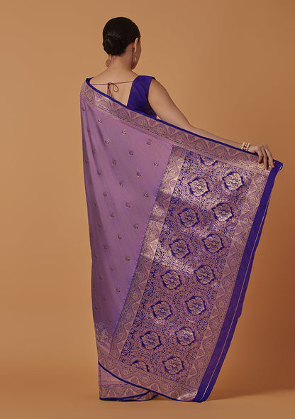 Monjolika Fashion Lavender Banarasi Silk Blend SareeWith Traditional & Modern Dulha Dulhan Figure Zari Woven Detailing