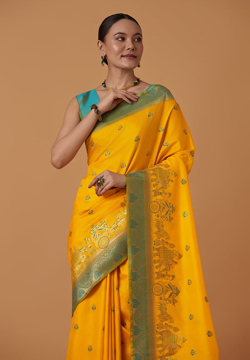 Monjolika Fashion Yellow Banarasi Silk Blend SareeWith Traditional & Modern Dulha Dulhan Figure Zari Woven Detailing