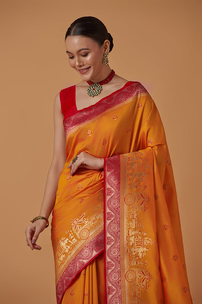 Monjolika Fashion Amber Banarasi Silk Blend SareeWith Traditional & Modern Dulha Dulhan Figure Zari Woven Detailing