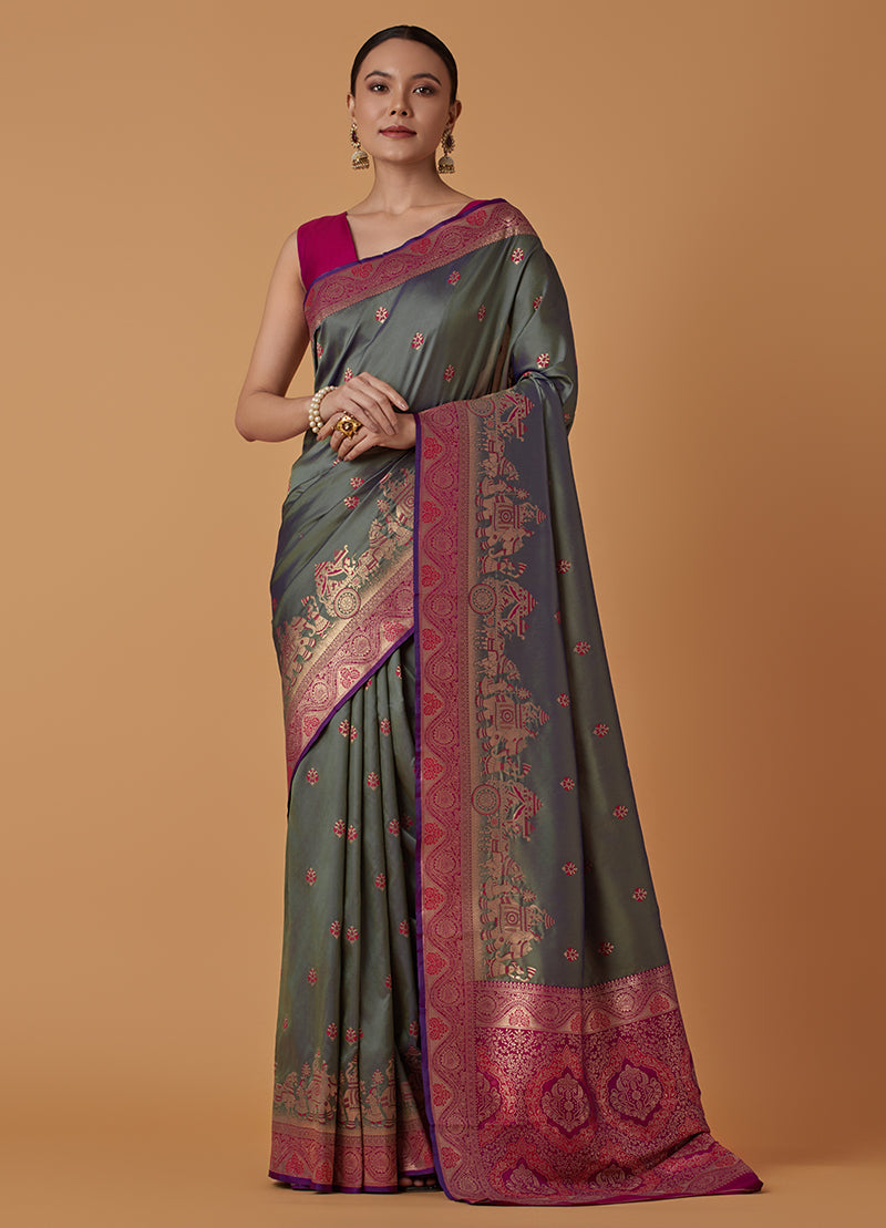 Monjolika Fashion Olive Banarasi Silk Blend SareeWith Traditional & Modern Dulha Dulhan Figure Zari Woven Detailing
