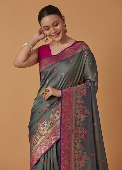 Monjolika Fashion Olive Banarasi Silk Blend SareeWith Traditional & Modern Dulha Dulhan Figure Zari Woven Detailing