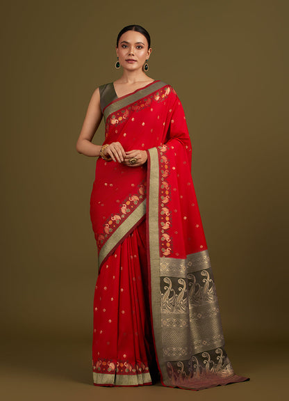 Monjolika Fashion Red Banarasi Silk Blend SareeIn Classic Paisley & Rich Zari Pallu Comes With Unstitched Blouse