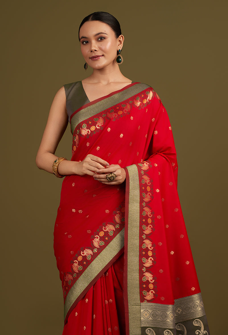 Monjolika Fashion Red Banarasi Silk Blend SareeIn Classic Paisley & Rich Zari Pallu Comes With Unstitched Blouse