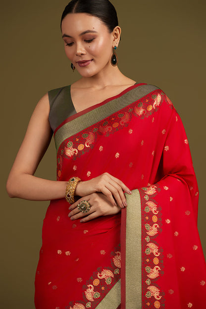 Monjolika Fashion Red Banarasi Silk Blend SareeIn Classic Paisley & Rich Zari Pallu Comes With Unstitched Blouse