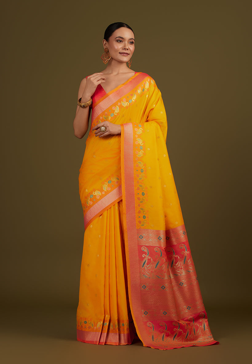 Monjolika Fashion Yellow Banarasi Silk Blend SareeIn Classic Paisley & Rich Zari Pallu Comes With Unstitched Blouse
