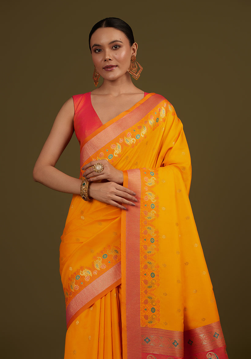 Monjolika Fashion Yellow Banarasi Silk Blend SareeIn Classic Paisley & Rich Zari Pallu Comes With Unstitched Blouse