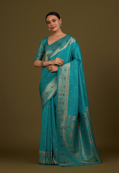 Monjolika Fashion Elegant Cyan Banarasi Silk Blend SareeBrocade Motifs & Zari Woven Splendor