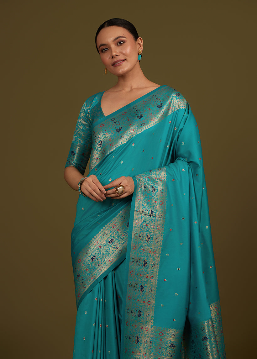 Monjolika Fashion Elegant Cyan Banarasi Silk Blend SareeBrocade Motifs & Zari Woven Splendor