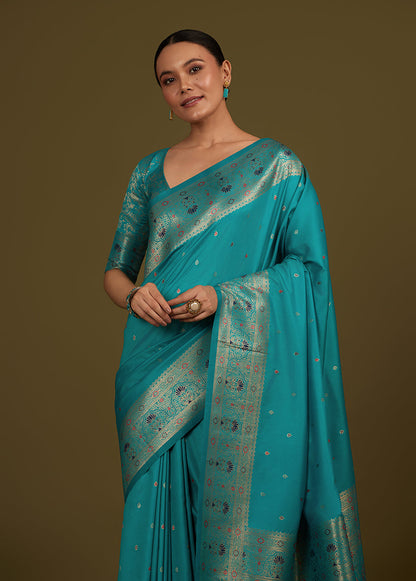 Monjolika Fashion Elegant Cyan Banarasi Silk Blend SareeBrocade Motifs & Zari Woven Splendor