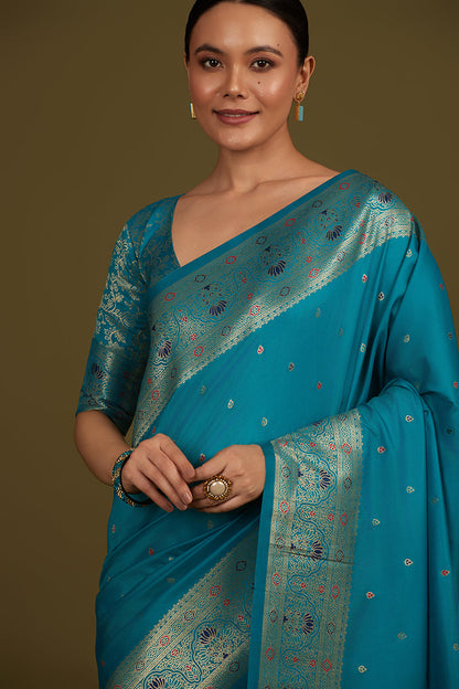 Monjolika Fashion Elegant Cyan Banarasi Silk Blend SareeBrocade Motifs & Zari Woven Splendor