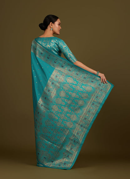 Monjolika Fashion Elegant Cyan Banarasi Silk Blend SareeBrocade Motifs & Zari Woven Splendor