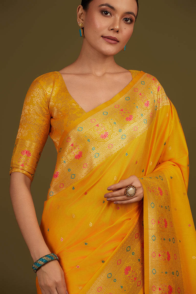 Monjolika Fashion Elegant Yellow Banarasi Silk Blend SareeBrocade Motifs & Zari Woven Splendor