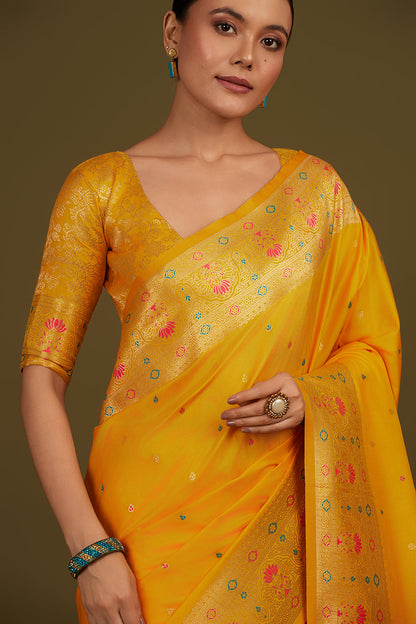 Monjolika Fashion Elegant Yellow Banarasi Silk Blend SareeBrocade Motifs & Zari Woven Splendor