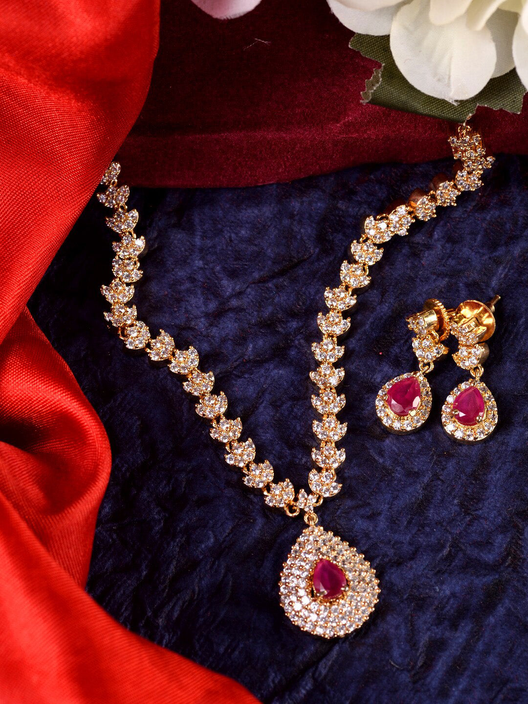 Saraf RS Jewellery Gold-Polished White & Red American Diamond Studded & Beaded Handcrafted Jewellery Set