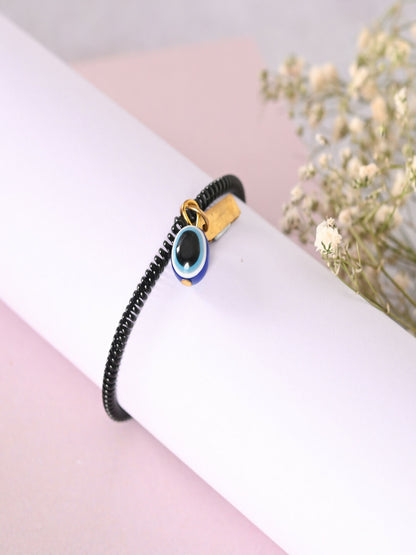 NVR Women & Men Black Evil Eye Spring Ring Rakhi With Roli Chawal