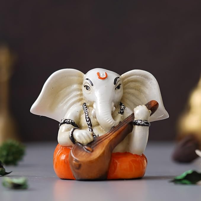 Ecraftindia White & Orange Polyresin Handcrafted Lord Ganesha Idol Playing Veena Musical Instrument