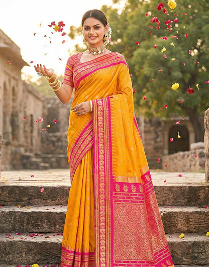 Monjolika Fashion Mustard Banarasi Silk Blend Saree with Rani Pink Zari Border