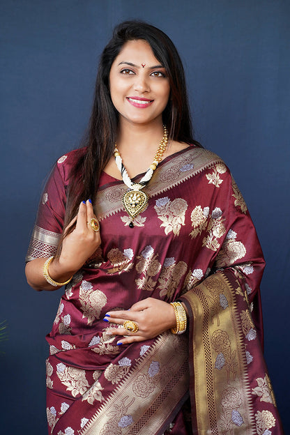 Monjolika Fashion Maroon Woven Banarasi Silk Blend Saree With Blouse