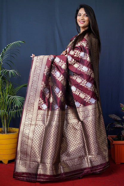 Monjolika Fashion maroon Woven Banarasi Silk Blend Saree With Blouse