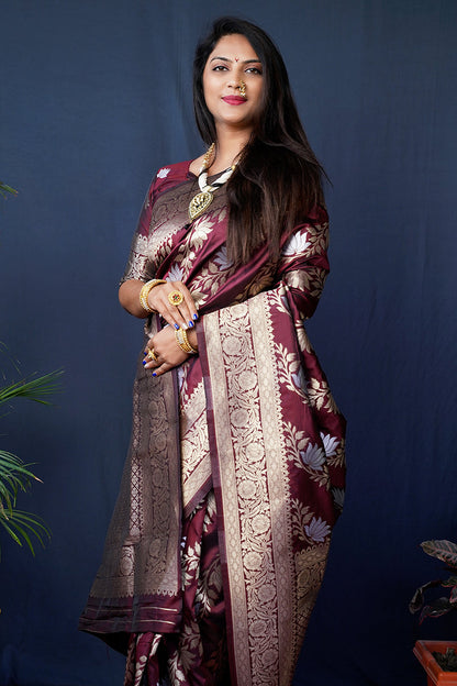 Monjolika Fashion maroon Woven Banarasi Silk Blend Saree With Blouse
