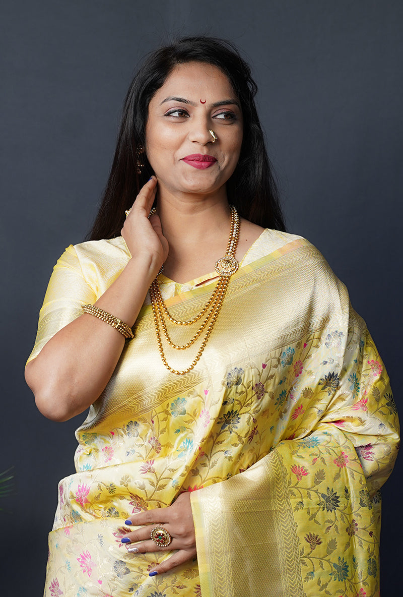 Monjolika Fashion Lemon Yellow Banarasi Silk Blend Saree With Floral Jaal & Zari Border