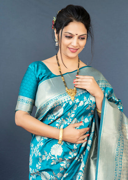 Monjolika Fashion Aqua Blue Banarasi Silk Blend Saree With Floral Zari Weaving