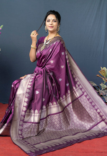 Monjolika Fashion Wine Purple Banarasi Silk Blend Saree with Silver Zari Border & Woven Pallu