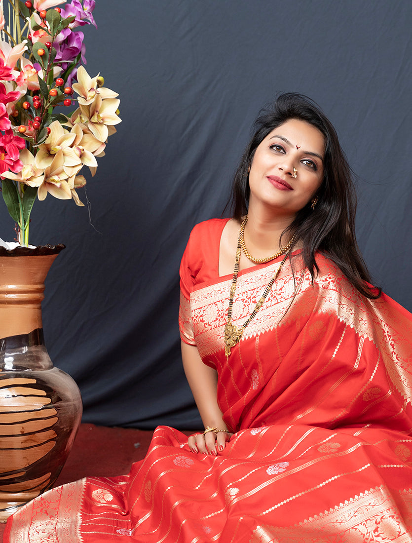 Monjolika Fashion Red Banarasi Silk Blend Saree With Zari Border & Woven Pallu