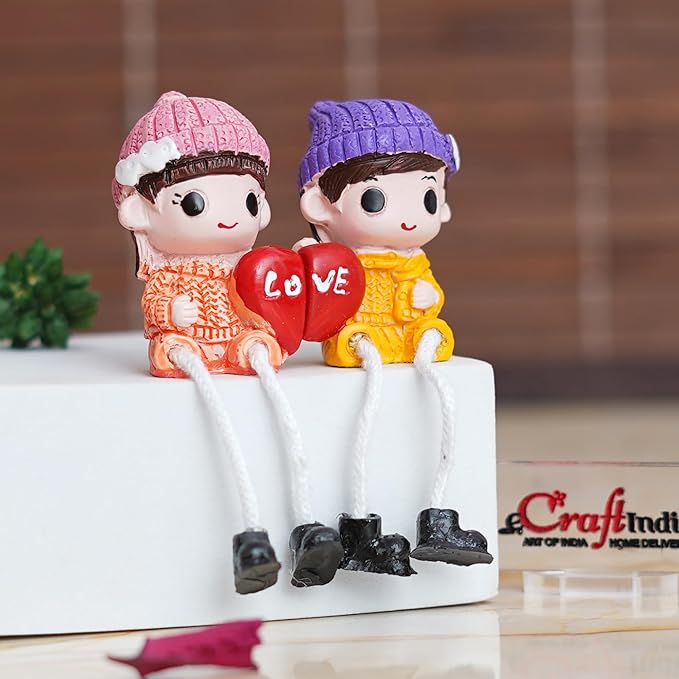 Ecraftindia Cute Boy and Girl Doll Sitting Couple Statue Holding Heart Love Decorative Showpiece