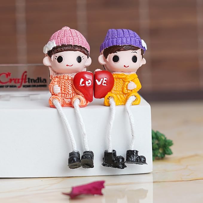Ecraftindia Cute Boy and Girl Doll Sitting Couple Statue Holding Heart Love Decorative Showpiece