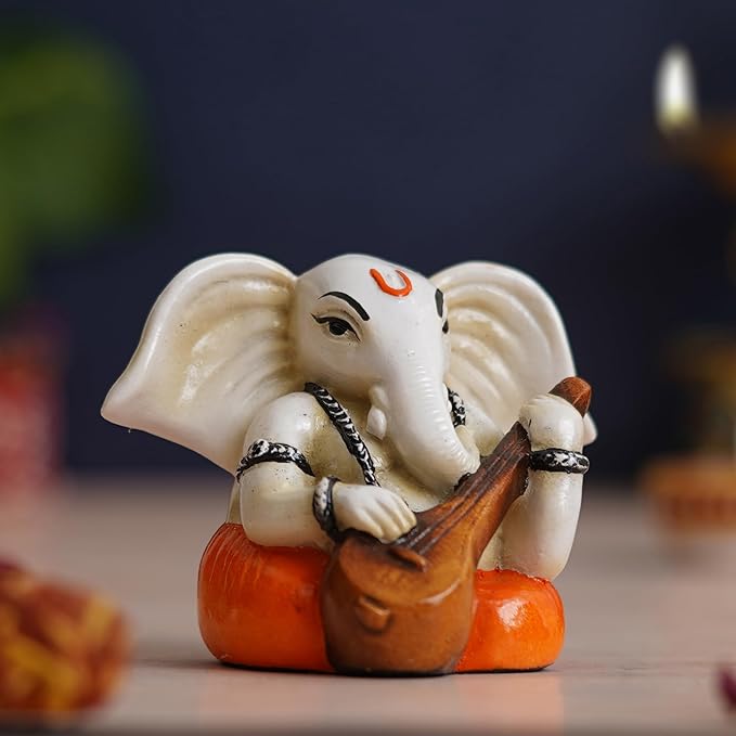 Ecraftindia White & Orange Polyresin Handcrafted Lord Ganesha Idol Playing Veena Musical Instrument