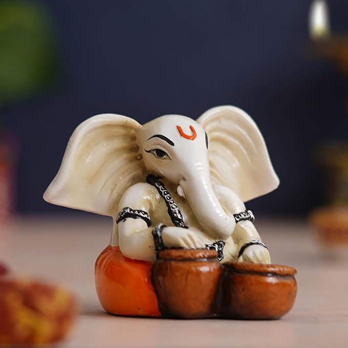 Ecraftindia White & Orange Polyresin Handcrafted Lord Ganesha Idol Playing Tabla Musical Instrument