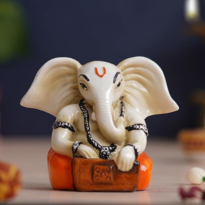 Ecraftindia White & Orange Polyresin Handcrafted Lord Ganesha Idol Playing Harmonium Musical Instrument