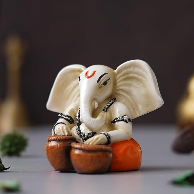 Ecraftindia White & Orange Polyresin Handcrafted Lord Ganesha Idol Playing Tabla Musical Instrument