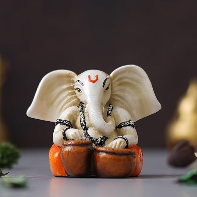 Ecraftindia White & Orange Polyresin Handcrafted Lord Ganesha Idol Playing Tabla Musical Instrument
