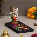 Ecraftindia Polyresin Baal Ganesh Dancing Showpiece With Rectangle Wooden Base Plate | Fragranced Petals & Tealight