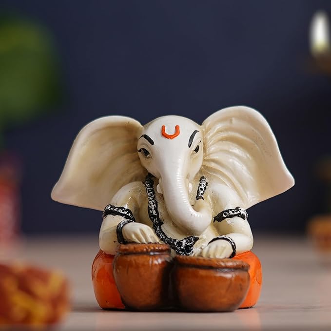 Ecraftindia White & Orange Polyresin Handcrafted Lord Ganesha Idol Playing Tabla Musical Instrument