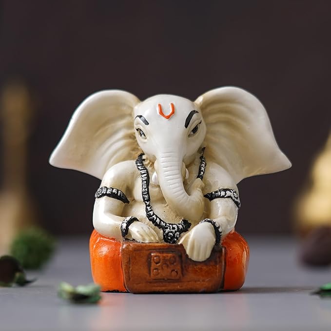 Ecraftindia White & Orange Polyresin Handcrafted Lord Ganesha Idol Playing Harmonium Musical Instrument